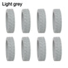 A set of light grey silicone luggage wheel protectors for protection and cushioning.