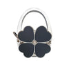 Silver foldable handbag hook with a black flower design.