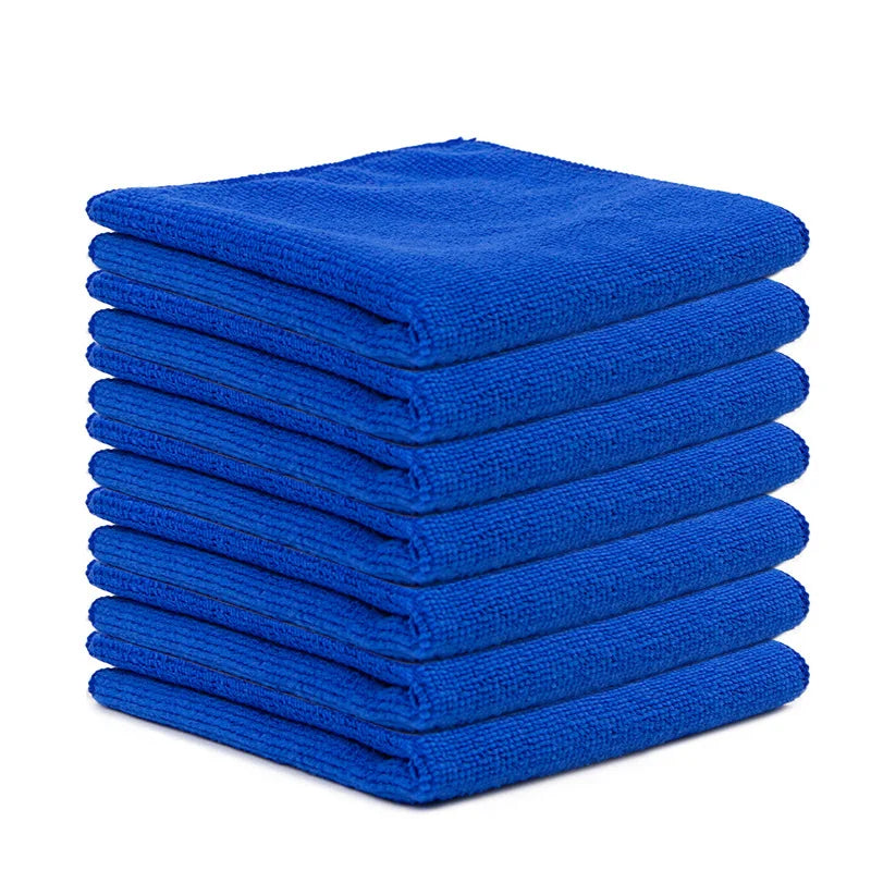 A stack of ten bright blue reusable microfiber cleaning cloths.