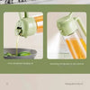 A green oil spray bottle is shown dispensing oil into a glass, demonstrating fine and uniform oil injection.