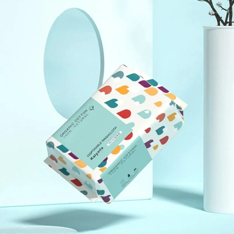 Eine Box wiederverwendbarer Baumwoll-Waschlappen für Make-up-Entfernung mit bunten Blumenmustern