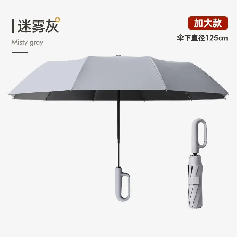 A gray automatic folding umbrella with a reinforced shaft, shown against a white background.