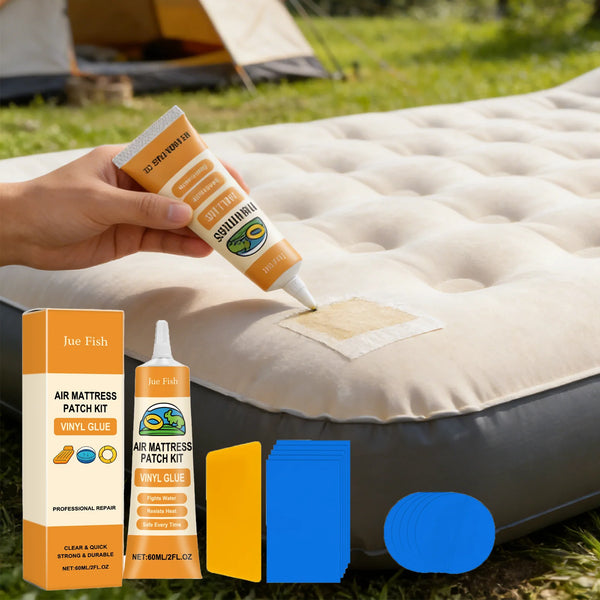 A hand applies vinyl glue to an air mattress patch kit on a beige outdoor mat.