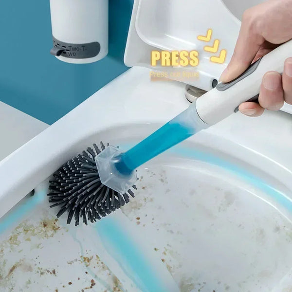 A hand is pressing a blue silicone toilet brush into a white porcelain toilet bowl.