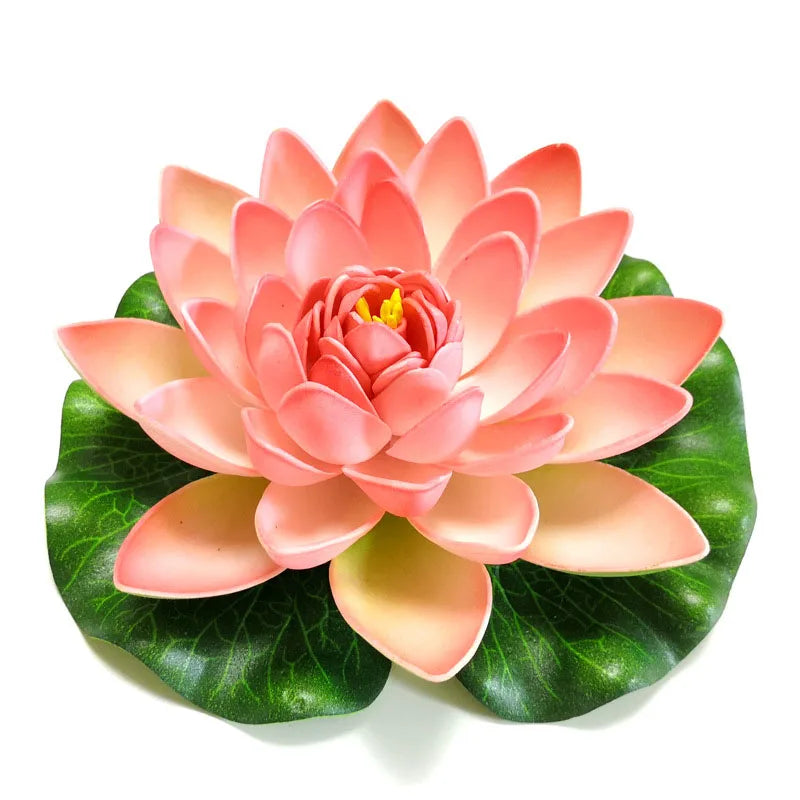 A vibrant pink artificial lotus flower blooming on green leaves.