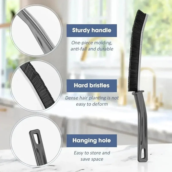 A black multi-purpose crevice cleaning brush with a sturdy handle, hard bristles, and a hanging hole.