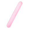 A pink, cylindrical portable toothbrush storage case viewed from the side.