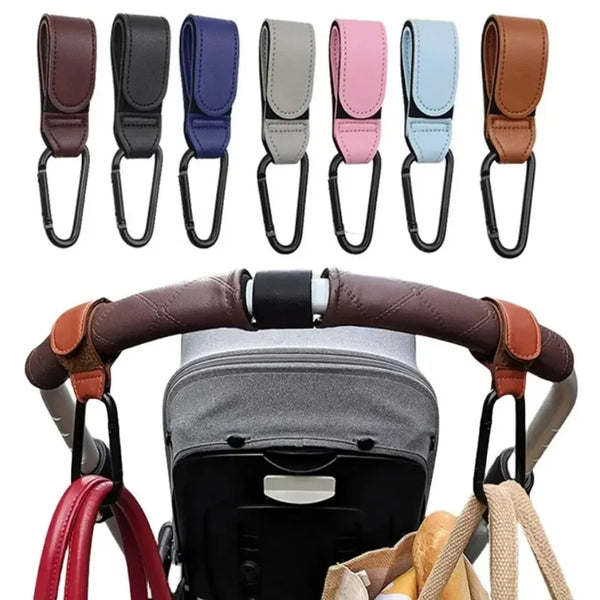 A collection of colorful and brown stroller hook carabiners and accessories displayed on a stroller handlebar.