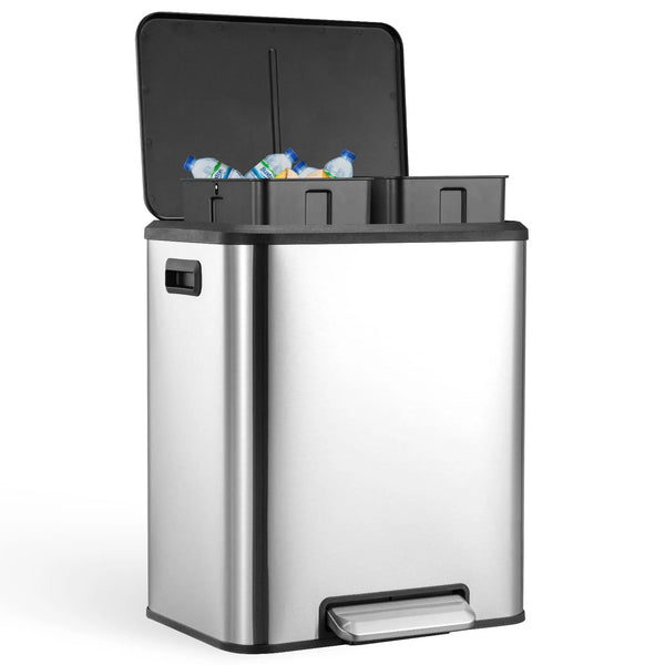 A stainless steel dual compartment trash can with a black lid and visible trash inside.