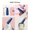 A pink mini travel umbrella is shown next to various cosmetic and personal care items.