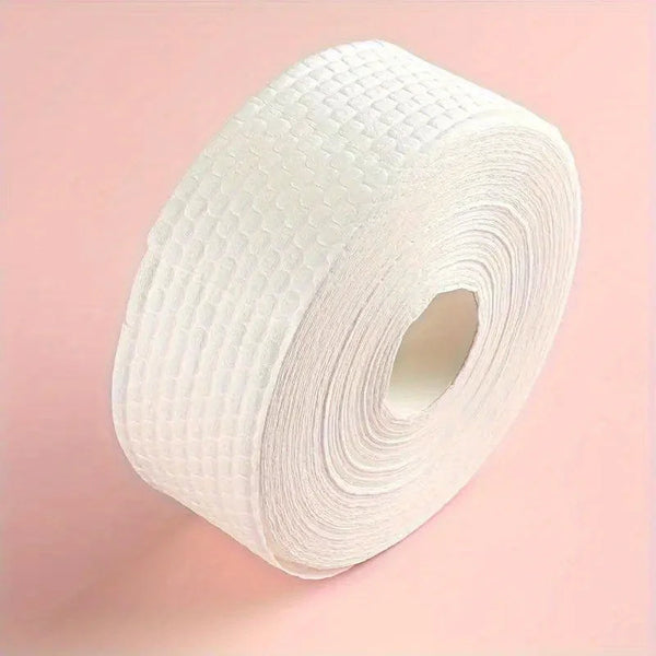 A roll of white professional cotton pads for nail and gel polish removal