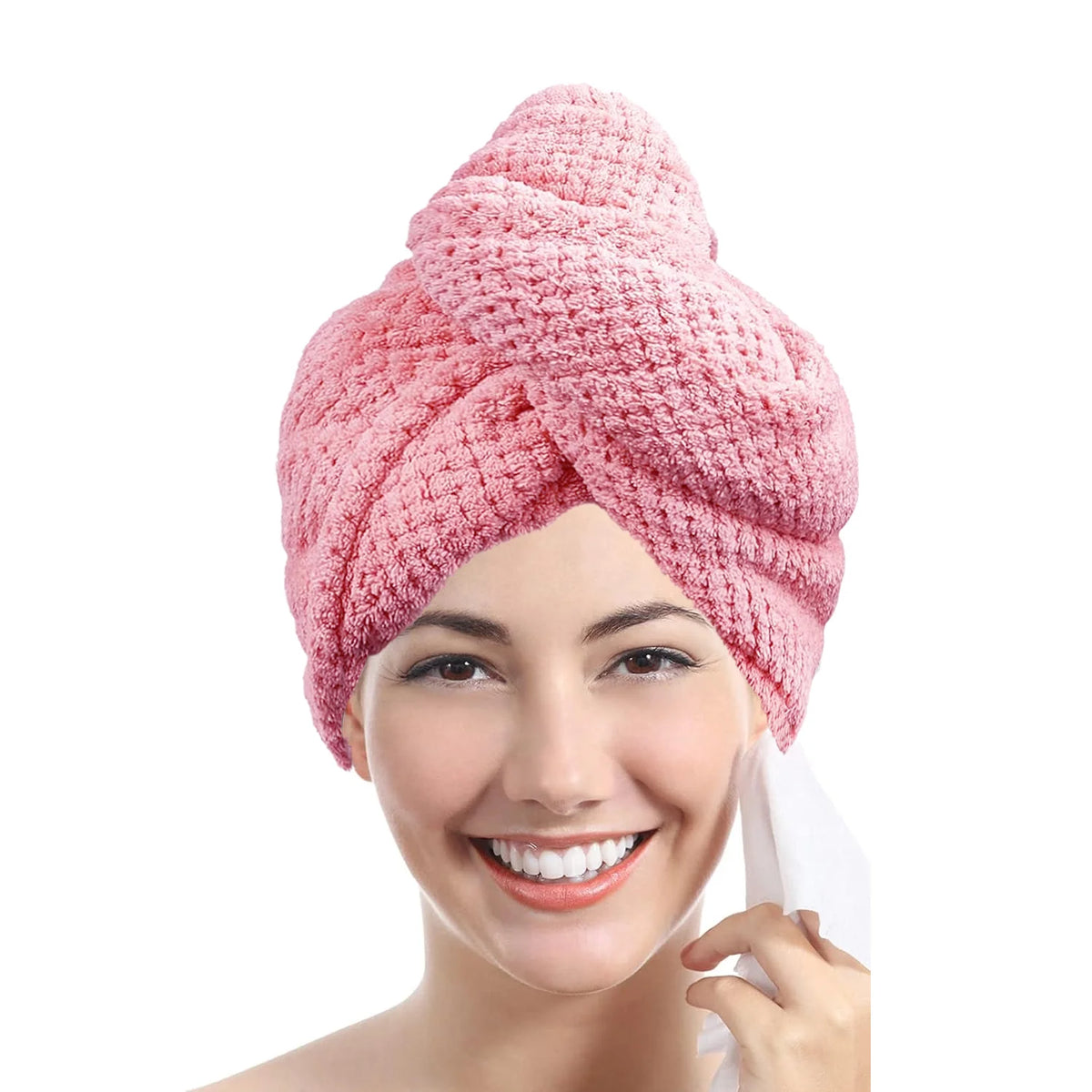 A woman is smiling while wearing a pink microfiber hair drying towel wrap on her head.