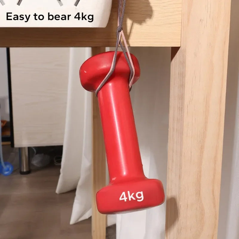 A red wall hook labeled 4kg is hanging from a wooden shelf.