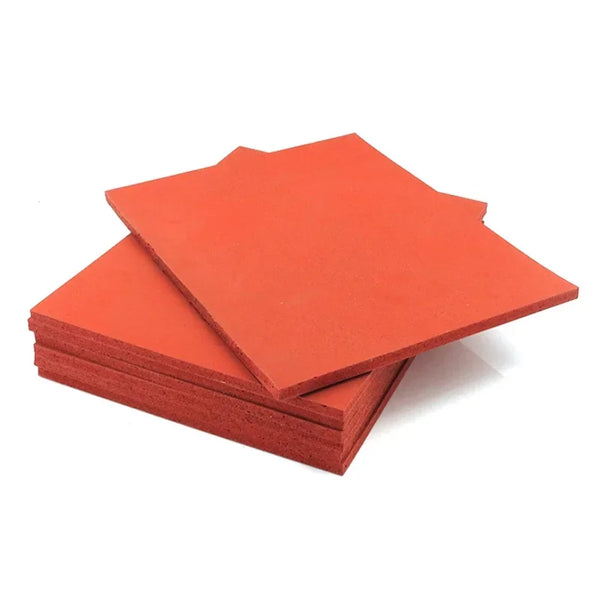 Stack of orange silicone foam mats