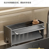 A stainless steel kitchen sink caddy with a draining tray is shown mounted on a sink, designed for holding sponges and dish t