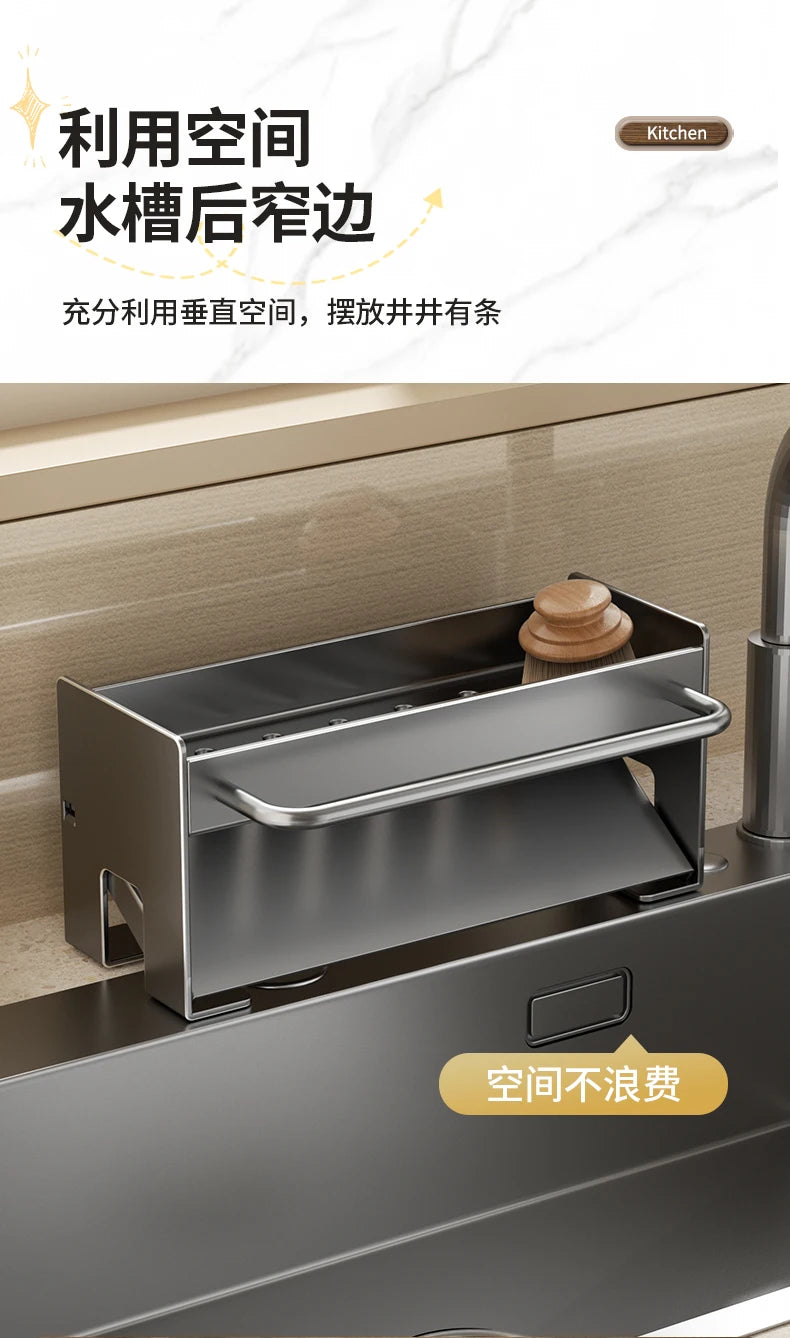 A stainless steel kitchen sink caddy with a draining tray is shown mounted on a sink, designed for holding sponges and dish t