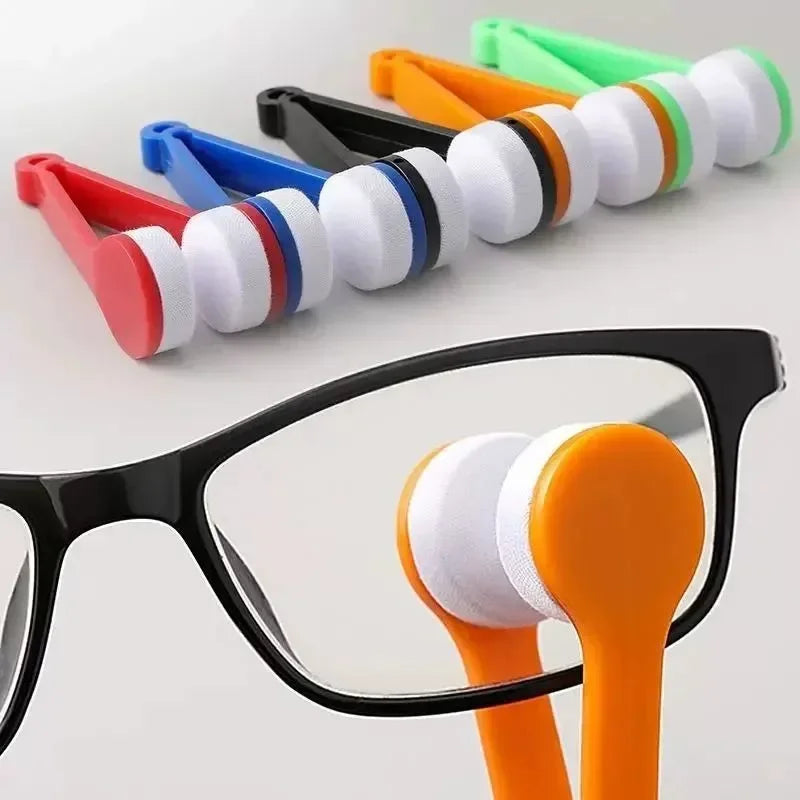 A set of colorful two-sided microfiber cleaning brushes for eyeglasses, shown alongside a pair of orange brush heads.