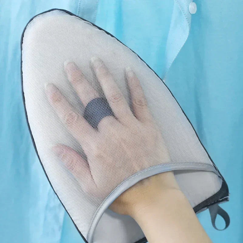 A hand is placed on a portable, clear mesh ironing board used for garment steaming.