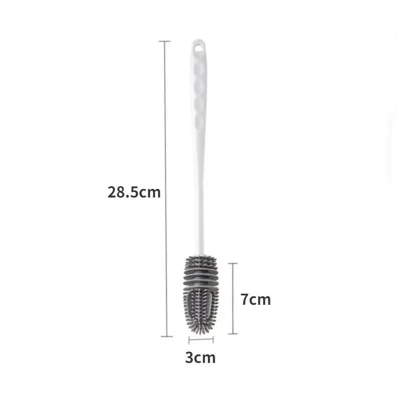 A silicone bottle brush with a long handle and a bristled cleaning head.