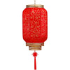 A durable antiqued red Chinese lantern with a gold rim and decorative tassel.