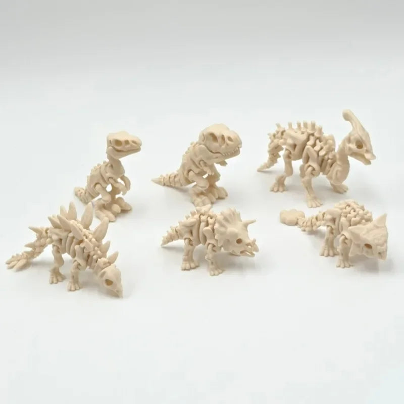 A collection of light beige 3D printed dinosaur skeleton figures displayed on a white background.