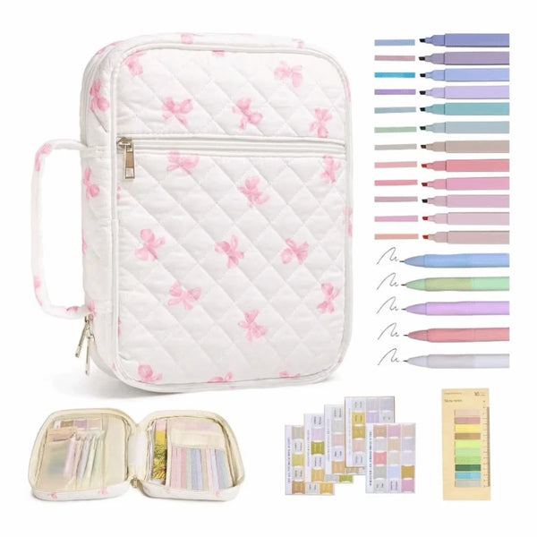 A white floral quilted Bible cover bag with a zipper and handle, shown alongside various colored pencils.