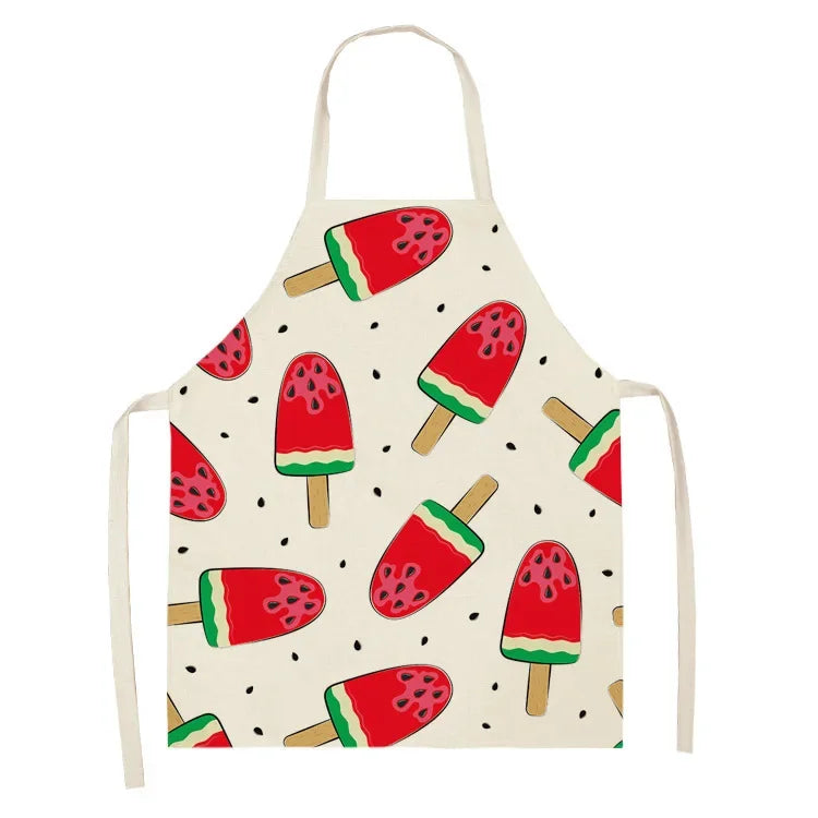 A white linen apron with a repeating pattern of sliced watermelon fruit designs.