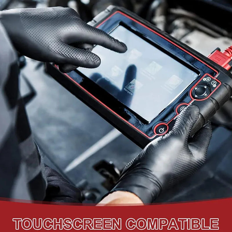 A hand wearing a black glove touches a digital device with a finger in a close-up shot.