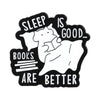 Pin de esmalte negro con un elefante durmiendo y el texto: 'El sueño es bueno, los libros son mejores'