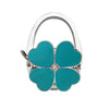 Silver foldable handbag hook with a turquoise flower design and a sparkling center.