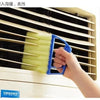 A hand is using a blue multi-functional cleaning brush to clean the slats of a window blind.