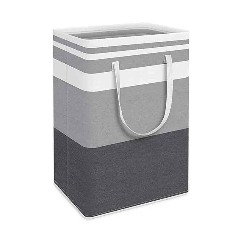 A large foldable canvas laundry hamper in gray and white stripes with handles.