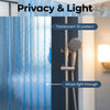 A close-up of a translucent blue 3D crystal texture shower curtain liner allowing light through.