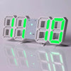 A row of digital LED alarm clocks displaying time and temperature in bright green light.