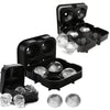 Black silicone ice cube molds with lids and several clear ice cubes