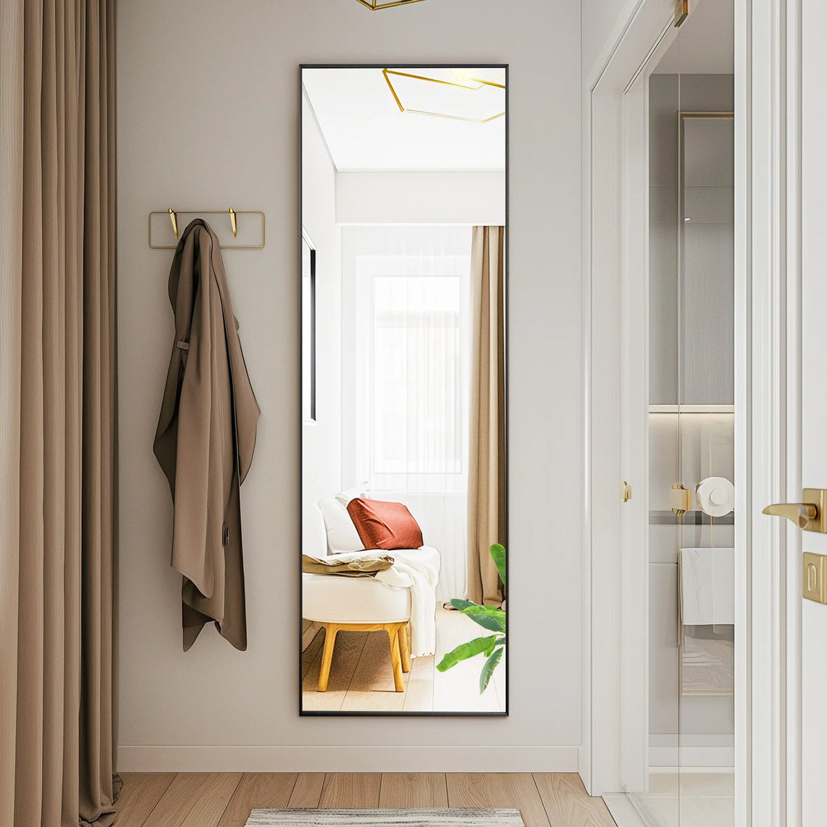 A full body standing wall mirror reflects a bright interior with sheer curtains and modern decor.