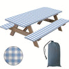 A plaid tablecloth set featuring a rectangular tablecloth and a matching rectangular placemat, made of durable fabric.