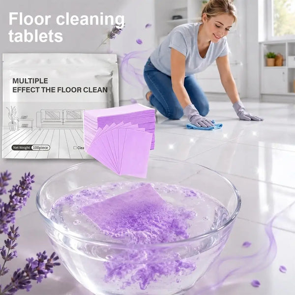 A woman is cleaning a floor with purple cleaning tablets in a glass bowl on a glossy white floor.