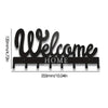 Black decorative metal key holder rack with hooks featuring the word Welcome Home