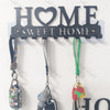 Rustic metal wall hook key holder with a heart sign and three hanging keys