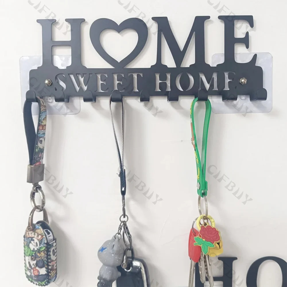 Rustic metal wall hook key holder with a heart sign and three hanging keys