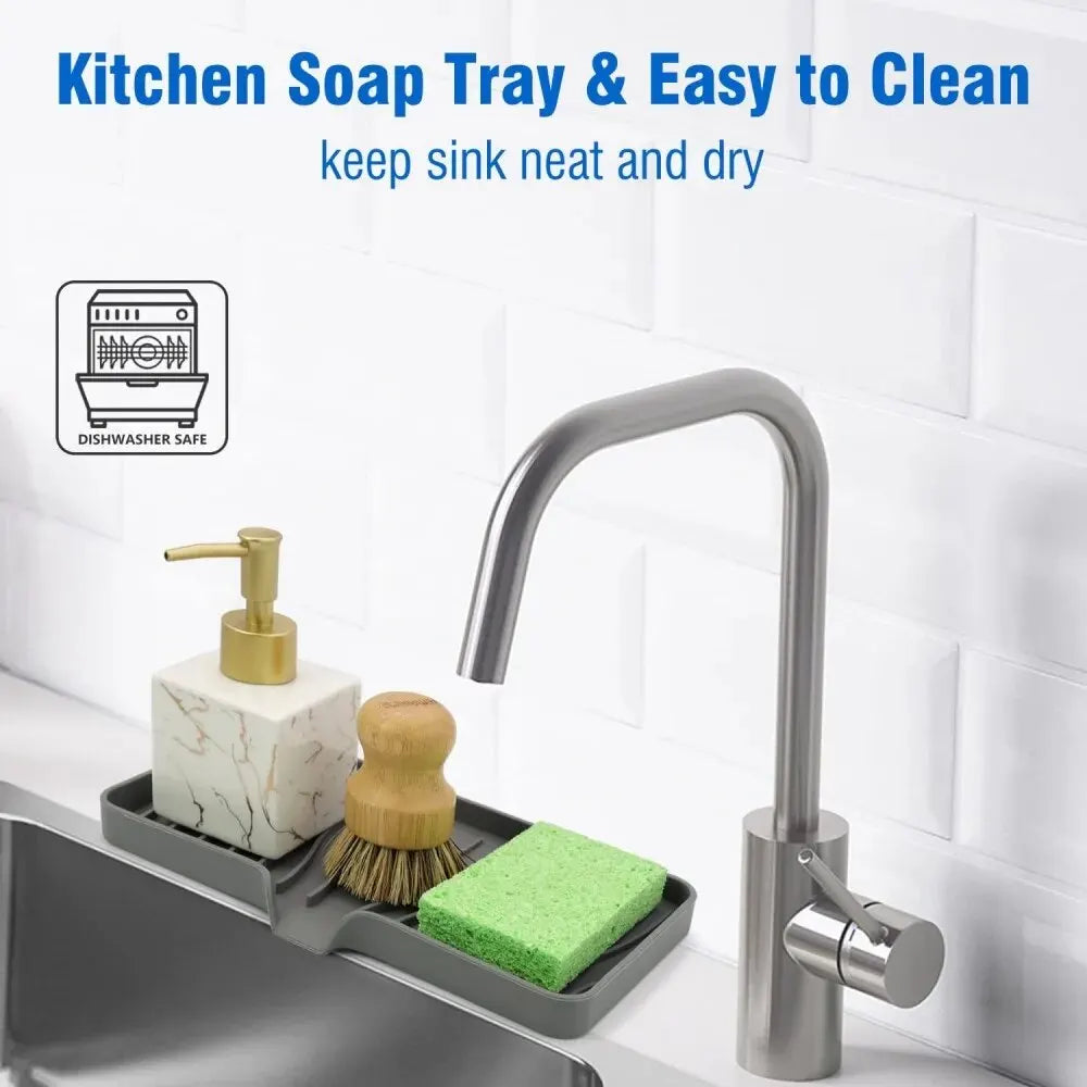 A kitchen soap tray organizer with a silicone draining tray and a modern faucet setup on a sink.