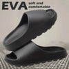 A pair of black EVA slides shown with text emphasizing soft and comfortable features.