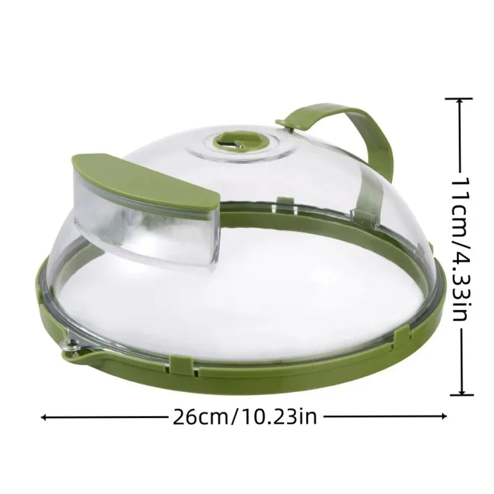 Clear microwave splatter cover with a green handle and water steamer component.