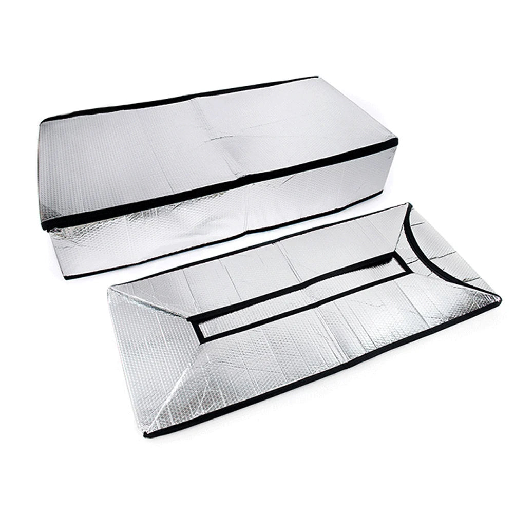 Silver foil attic heat and dust barrier sheets folded and laid out