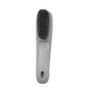 Brosse multifonction grise pour nettoyer les chaussures et les vêtements, avec une tête à poils.
