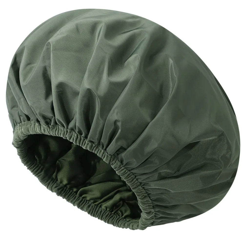 A dark olive green reusable satin-lined shower cap shown from above.