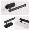 A black wall mounted toilet paper holder with a cylindrical bar and a rectangular plate.