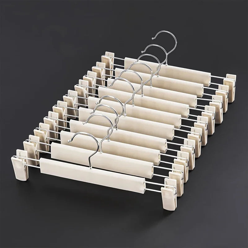 A rack of adjustable clothes hangers made of metal wire, designed for garments and bags.