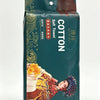 A package of green disposable cotton face towels featuring a floral design and a woman's portrait.